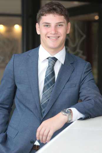 Noah Alter in a blue suit